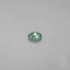 0.13カラットの天然グリーン/レッドアレキサンドライト（3.6×2.6 mm・オーバルカット）