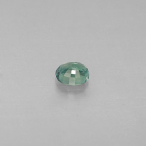 0.14カラットの天然グリーン/レッドアレキサンドライト（3.2×2.8 mm・オーバルカット）