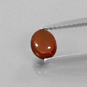 0.76カラットの天然オレンジレッドアルマンディンガーネット（5.8×4.7 mm・透明）