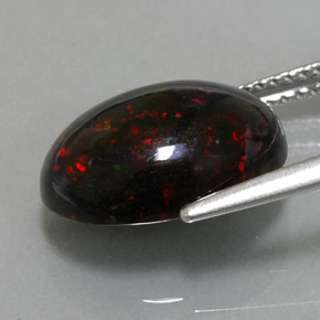 3.63カラットの天然マルチカラーブラックオパール（14.1×10 mm・オーバルカット）