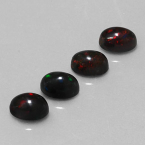 カラットの天然マルチカラーブラックオパール（6×4.1 mm・オーバルカット）