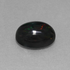 1.27カラットの天然マルチカラーブラックオパール（9.1×7.1 mm・オーバルカット）