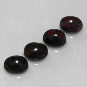 カラットの天然マルチカラーブラックオパール（8.1×6.1 mm・オーバルカット）