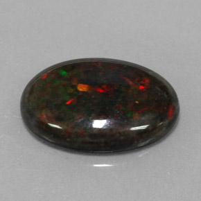 3.60カラットの天然マルチカラーブラックオパール（16.3×12 mm・オーバルカット）