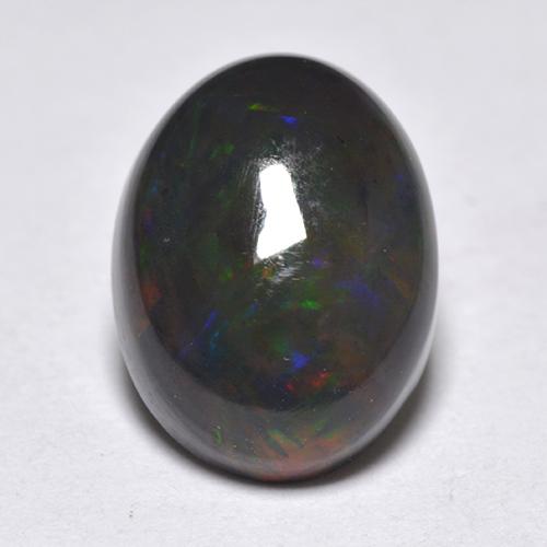 1.33カラットの天然マルチカラーブラックオパール（9.4×7 mm・オーバルカット）