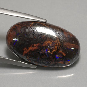 12.97カラットの天然マルチカラーボルダーオパール（21.7×12.6 mm・オーバルカット）
