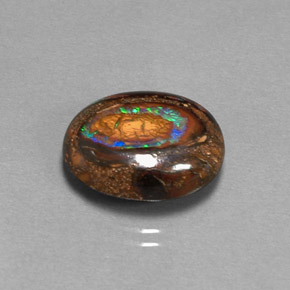 7.70カラットの天然マルチカラーボルダーオパール（15×12.2 mm・オーバルカット）