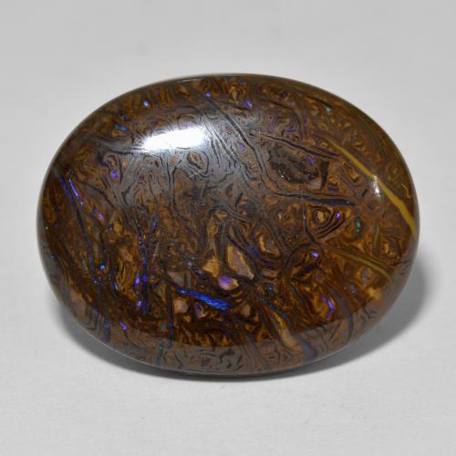 22.16カラットの天然マルチカラーボルダーオパール（22.7×18.1 mm・オーバルカット）
