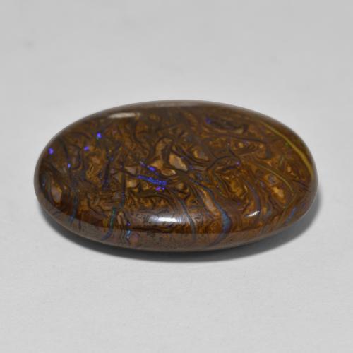 22.16カラットの天然マルチカラーボルダーオパール（22.7×18.1 mm・オーバルカット）