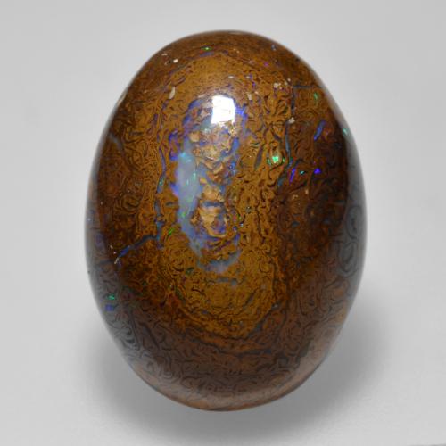 15.56カラットの天然マルチカラーボルダーオパール（19.3×14.3 mm・オーバルカット）