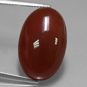 13.99カラットの天然レッドオレンジカーネリアン（21.7×14 mm・オーバルカット）