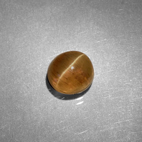 1.61カラットの天然ハニーCat's Eye Apatite（6.2×5.7 mm・オーバルカット）