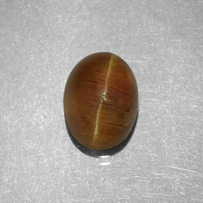 2.32カラットの天然ハニーキャッツアイアパタイト、オーバルカット、半透明