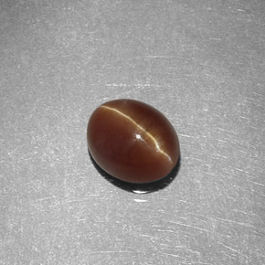 1.47カラットの天然ハニーCat's Eye Apatite（7×5.7 mm・オーバルカット）