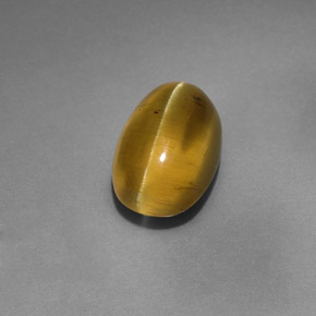 4.12カラットの天然ゴールデングリーンアパタイトキャッツアイ、透明、透明/半透明