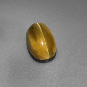 4.12カラットの天然ゴールデングリーンアパタイトキャッツアイ、透明、透明/半透明