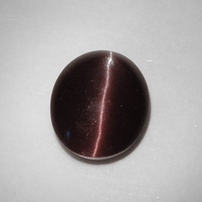 5.88カラットの天然ダークブラウンCat's Eye Scapolite（12.9×10.7 mm・オーバルカット）