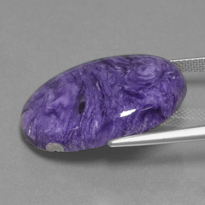 20.31カラットの天然バイオレットチャロアイト、オーバルカット、オペーク