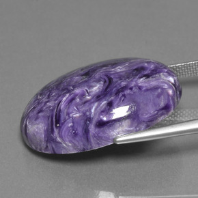 24.07カラットの天然バイオレットチャロアイト、オーバルカット、オペーク