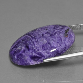 31.76カラットの天然ベルベットパープルバイオレットチャロアイト、オーバルカット、オペーク