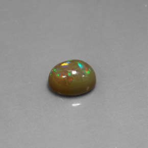 1.03カラットの天然マルチカラーチョコレートオパール（8×6.2 mm・透明）