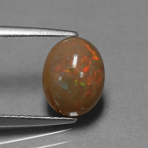 1.42カラットの天然マルチカラーチョコレートオパール（9.1×7.1 mm・オーバルカット）