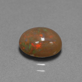 1.42カラットの天然マルチカラーチョコレートオパール（9.1×7.1 mm・オーバルカット）