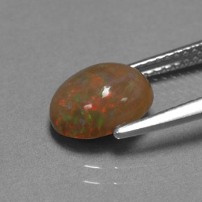 1.42カラットの天然マルチカラーチョコレートオパール（9.1×7.1 mm・オーバルカット）