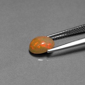 0.85カラットの天然マルチカラーチョコレートオパール、透明、透明/半透明