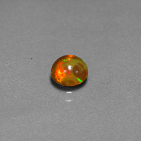 0.60カラットの天然マルチカラーチョコレートオパール（6.07 mm・透明）