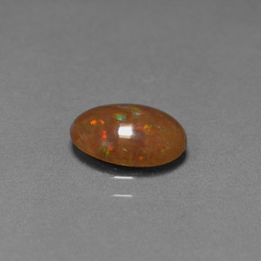0.83カラットの天然マルチカラーチョコレートオパール（9.1×6.9 mm・オーバルカット）