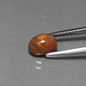 0.69カラットの天然マルチカラーチョコレートオパール、オーバルカット、オペーク