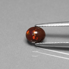 0.43カラットの天然マルチカラーチョコレートオパール、オーバルカット、オペーク