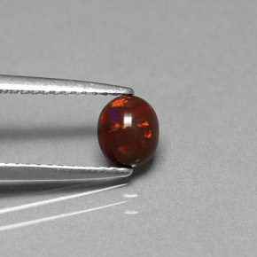 0.43カラットの天然マルチカラーチョコレートオパール、オーバルカット、オペーク