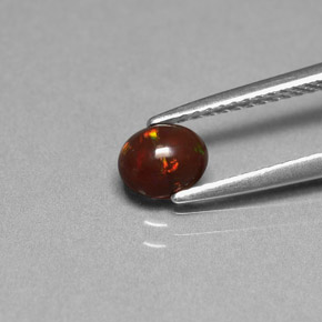 0.43カラットの天然マルチカラーチョコレートオパール、オーバルカット、オペーク