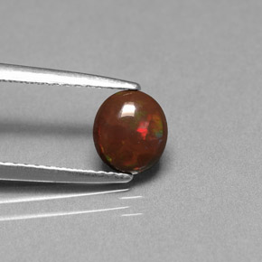 0.44カラットの天然マルチカラーチョコレートオパール、オーバルカット、オペーク