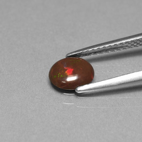 0.44カラットの天然マルチカラーチョコレートオパール、オーバルカット、オペーク