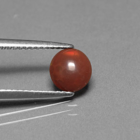 0.36カラットの天然マルチカラーチョコレートオパール（6.6×6.2 mm・オーバルカット）