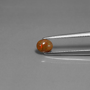 0.34カラットの天然マルチカラーチョコレートオパール、オーバルカット、オペーク