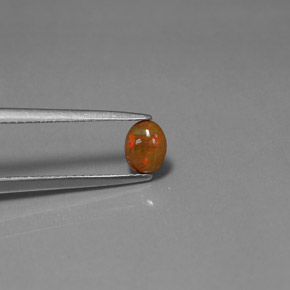 0.34カラットの天然マルチカラーチョコレートオパール、オーバルカット、オペーク