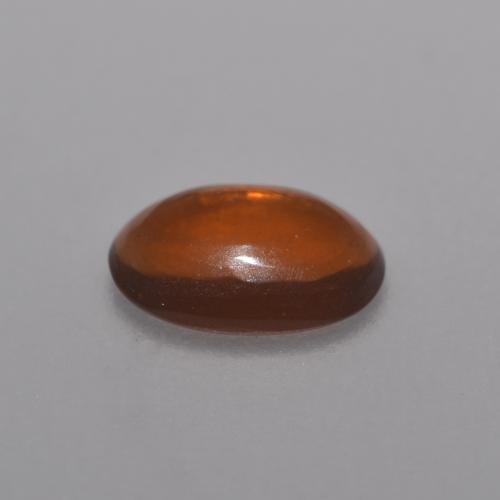 0.36カラットの天然アースオレンジチョコレートオパール（6.9×5 mm・オーバルカット）