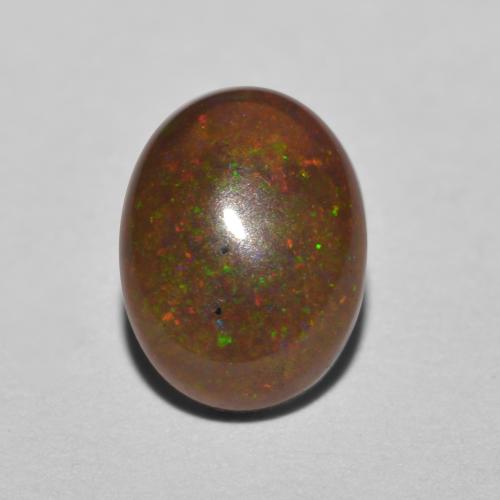 0.85カラットの天然マルチカラーチョコレートオパール（8×6.1 mm・オーバルカット）