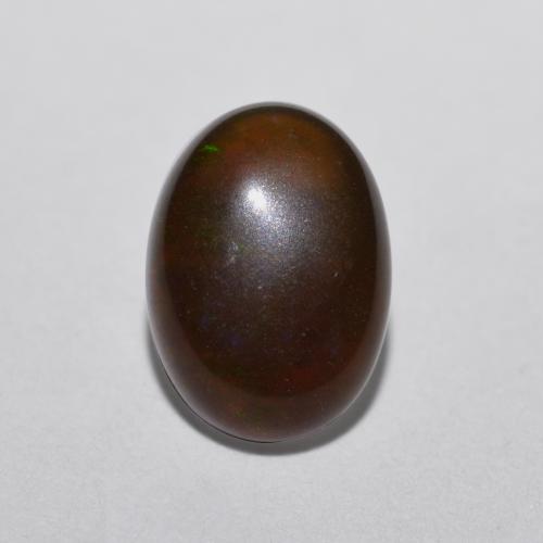0.52カラットの天然マルチカラーチョコレートオパール（8×5.8 mm・オーバルカット）