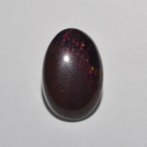0.80カラットの天然マルチカラーチョコレートオパール（8.9×6 mm・オーバルカット）
