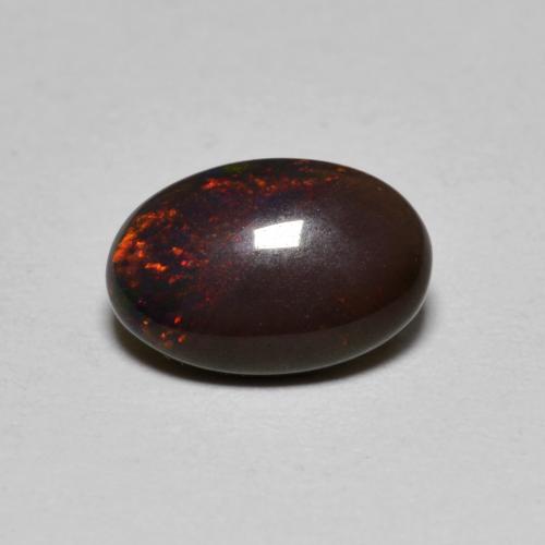 0.80カラットの天然マルチカラーチョコレートオパール（9×6 mm・オーバルカット）