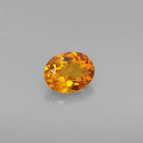 0.54カラットの天然イエローオレンジクリノヒューマイト（5.8×4.6 mm・オーバルカット）