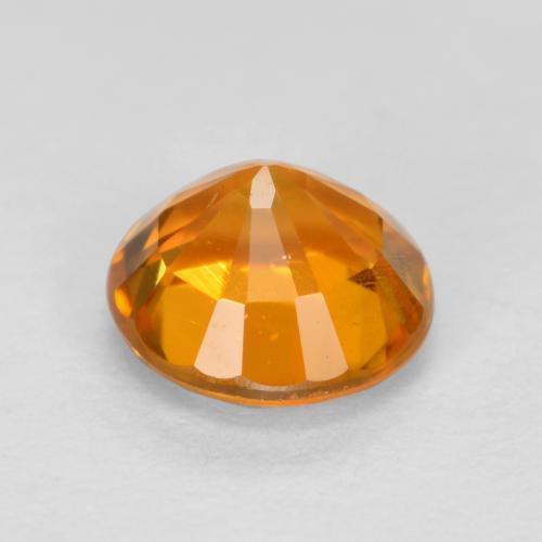 0.48カラットの天然アプリコットオレンジクリノヒューマイト（4.84 mm・ラウンドカット）