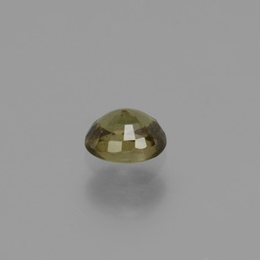 0.57カラットの天然緑がかった茶〜レッドピンクカラーチェンジガーネット（5.1×4.3 mm・オーバルカット）