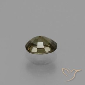 0.87カラットの天然アンバーブラウンカラーチェンジガーネット（6.1×4.8 mm・オーバルカット）