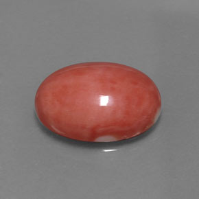 7.54カラットの天然サーモンサンゴ（16.1×12 mm・オーバルカット）
